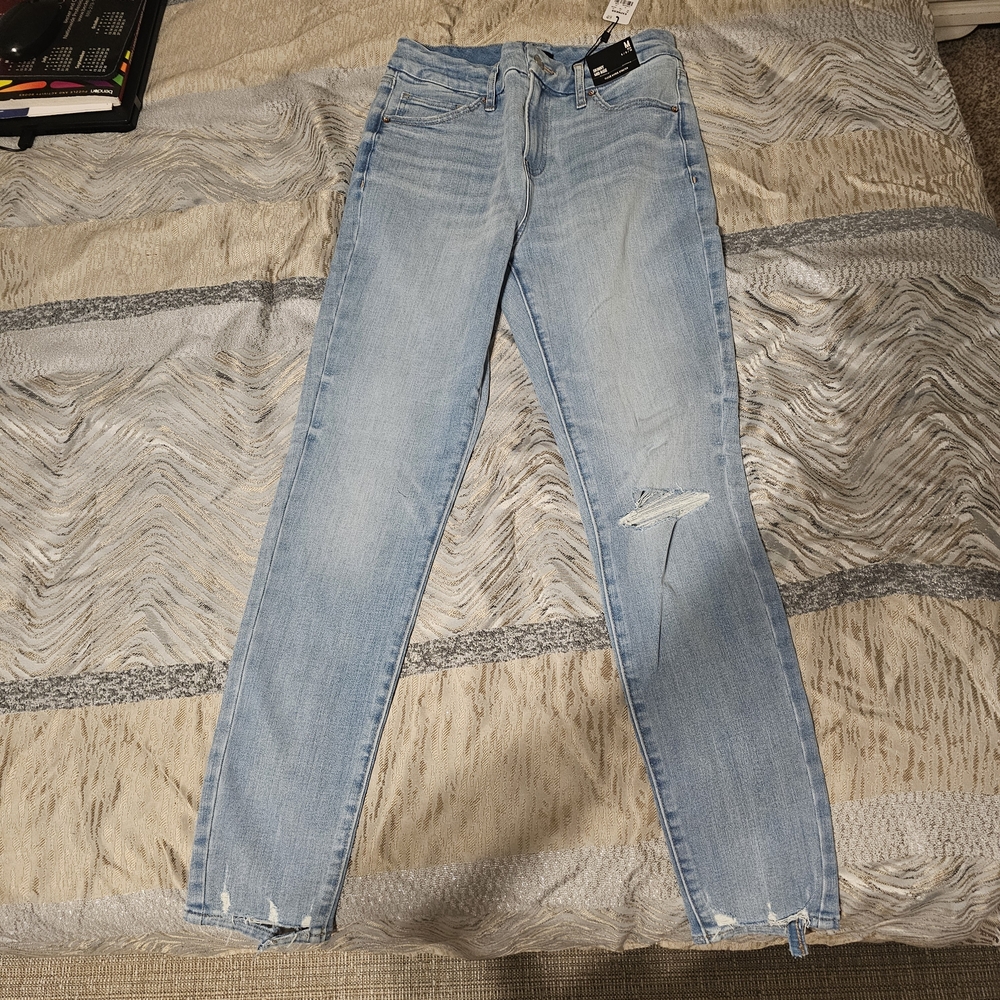 Express Light Wash Skinny Jeans with Distressed Knee
